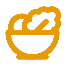 Bowl filled with food, featuring vegetables and a spoon.